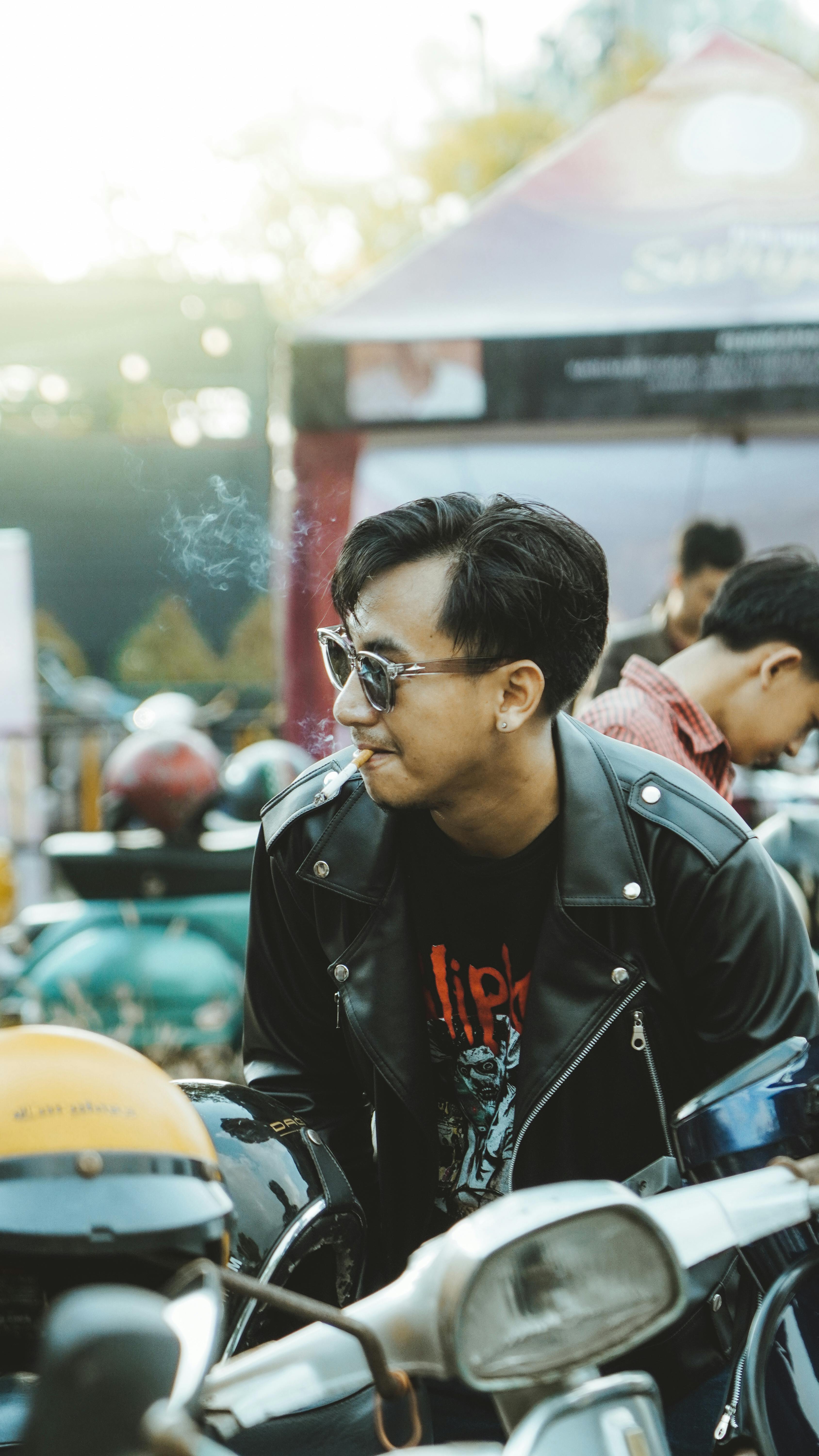 Free A young man in a leather jacket attends a motorcycle event in Bangkalan, East Java. Stock Photo