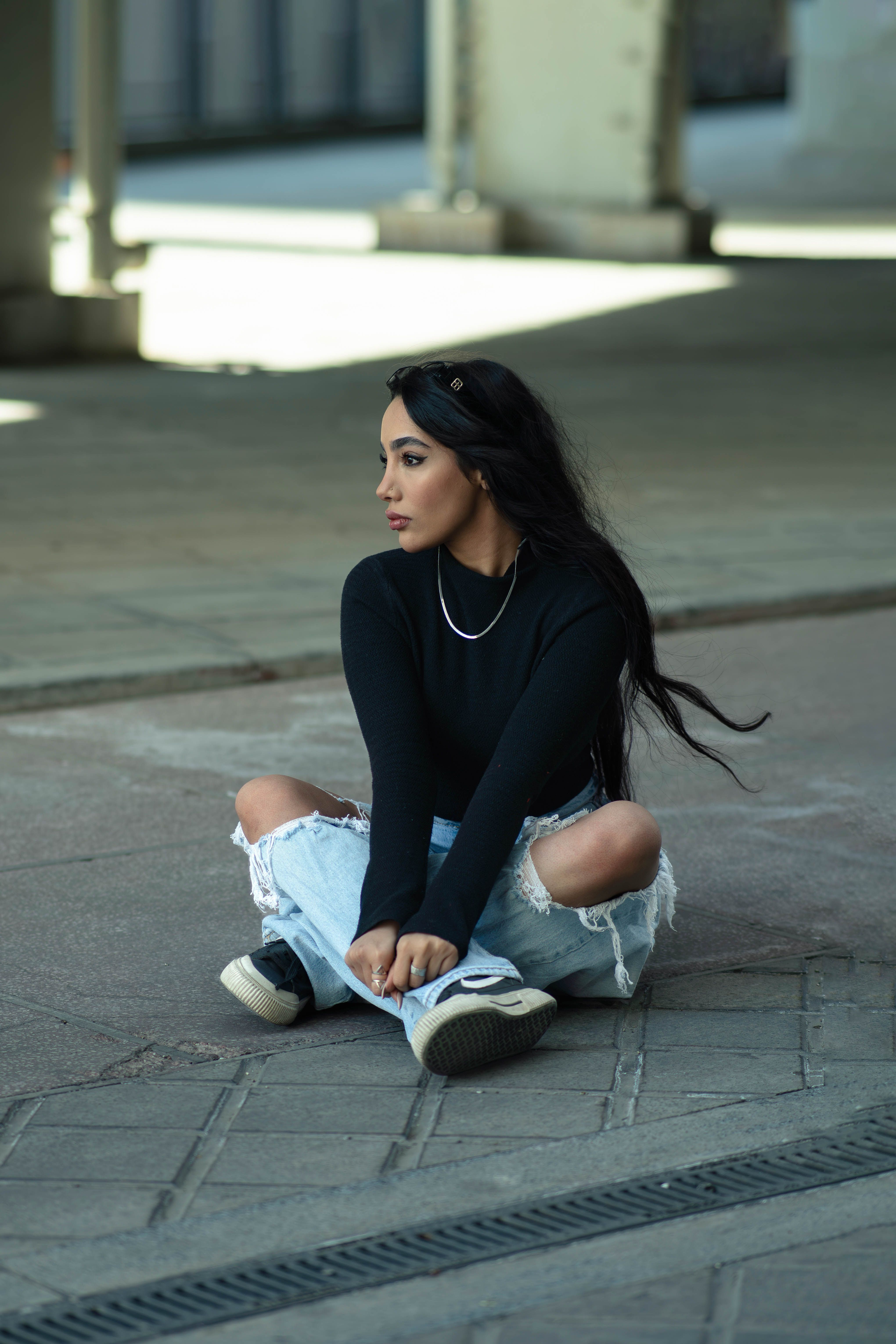 Casual Fashion Portrait of Woman Sitting Outdoors · Free Stock Photo