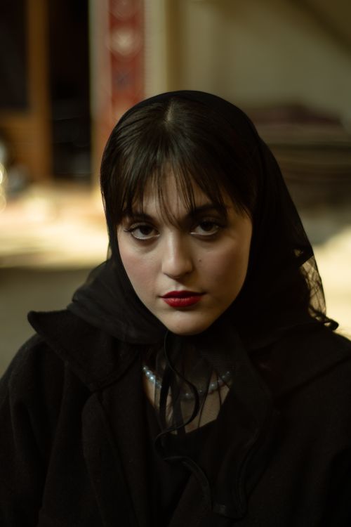 Free Artistic portrait of a woman with striking features, captured indoors in Tehran, Iran. Stock Photo