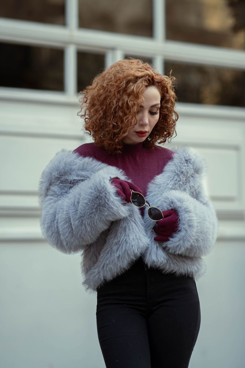 Woman in faux fur coat in an urban setting