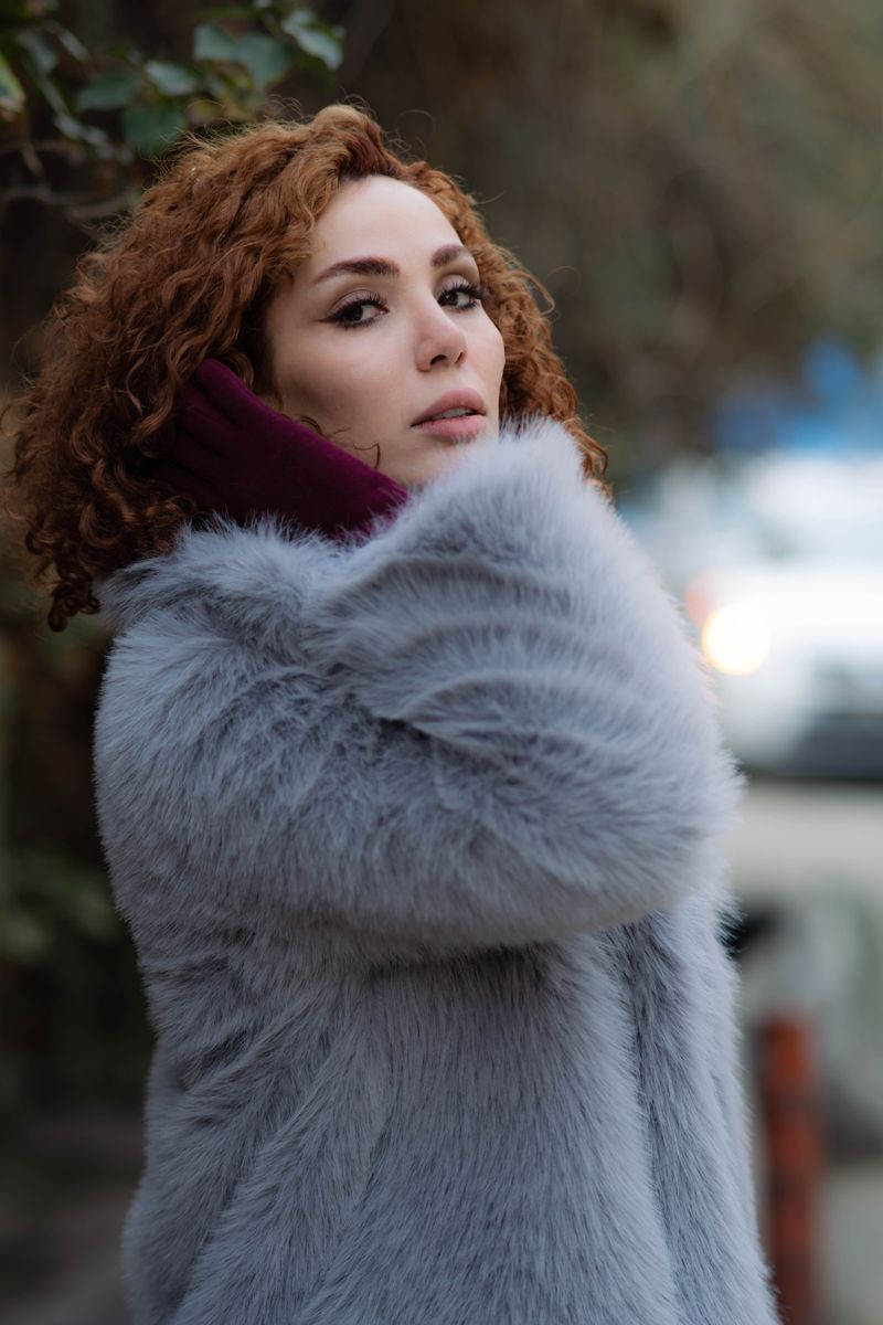 Woman in a fur coat on a city street
