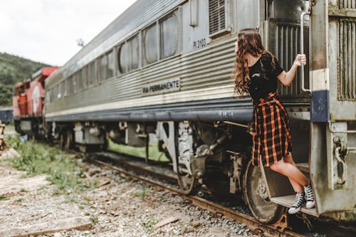Woman Standing on Train