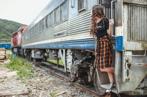 Woman in Gray Train