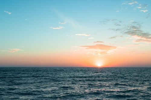 Free Beautiful sunset over Lake Michigan, capturing serene waters and a colorful sky. Stock Photo