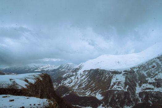 Breathtaking view of the snow-covered mountains in Georgia, showcasing the serene beauty of winter.