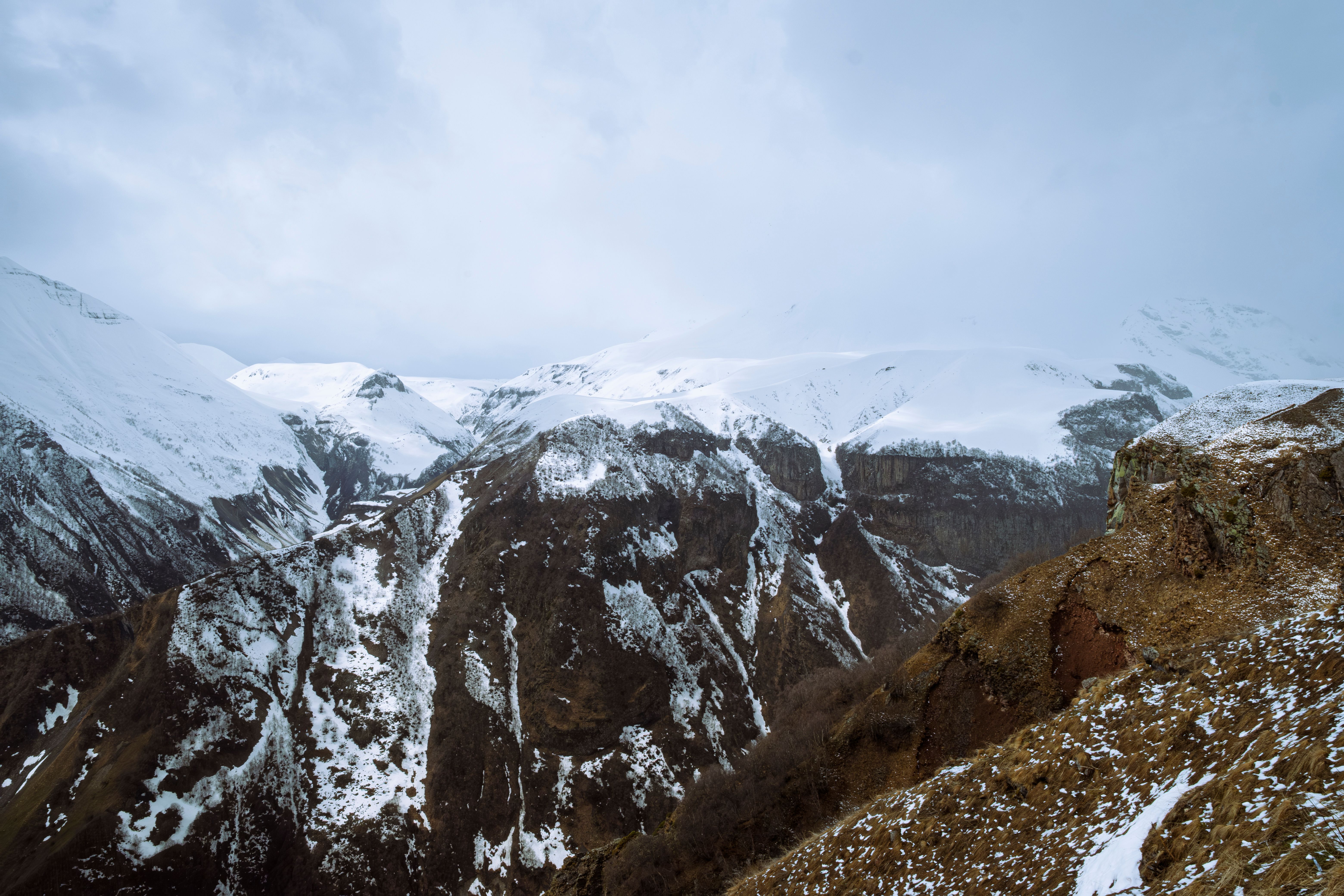 Marshrutka minibus traveling through scenic Georgian mountains