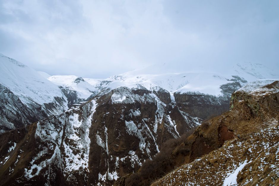 Marshrutka minibus traveling through scenic Georgian mountains