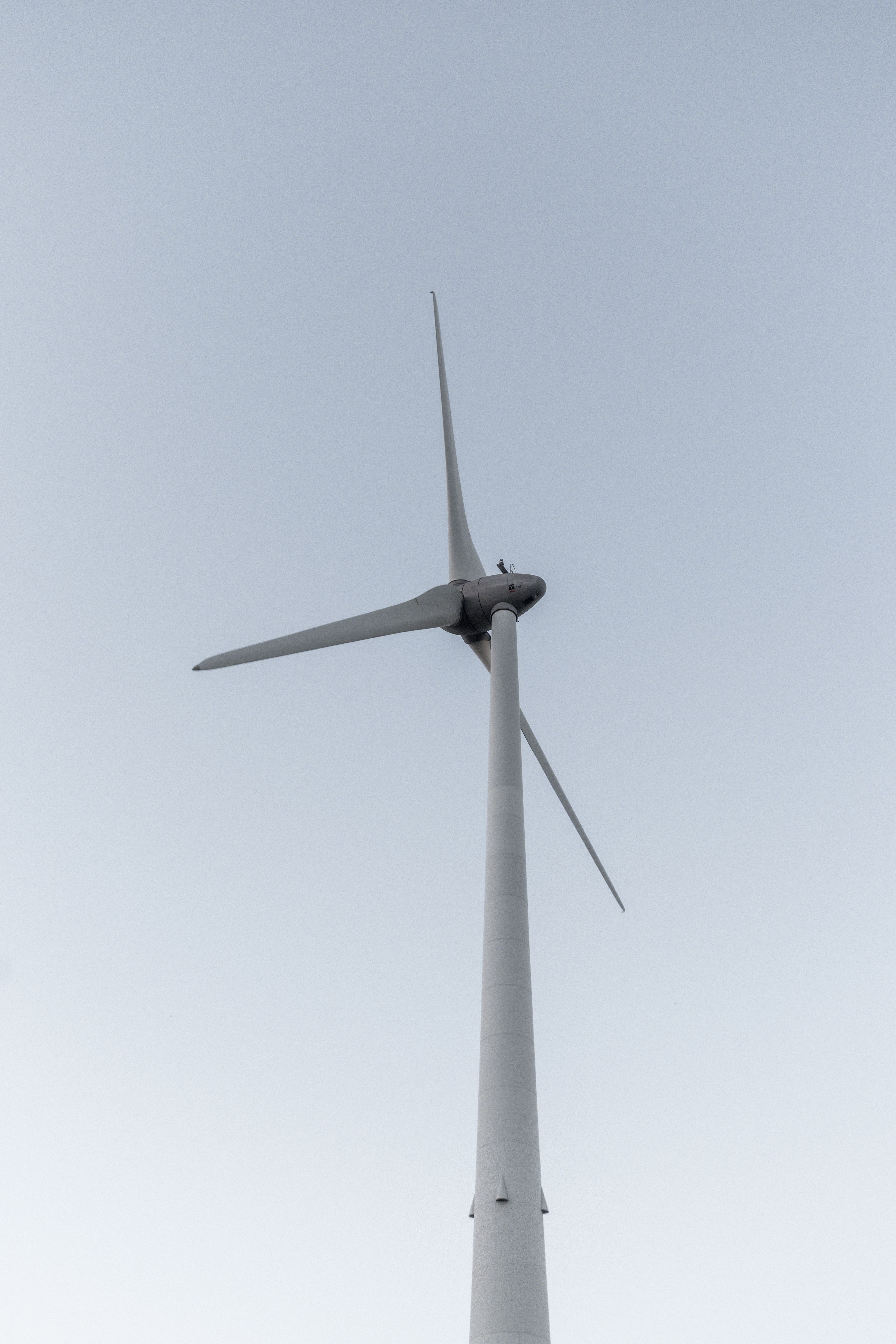Majestic Wind Turbine Against Clear Sky · Free Stock Photo