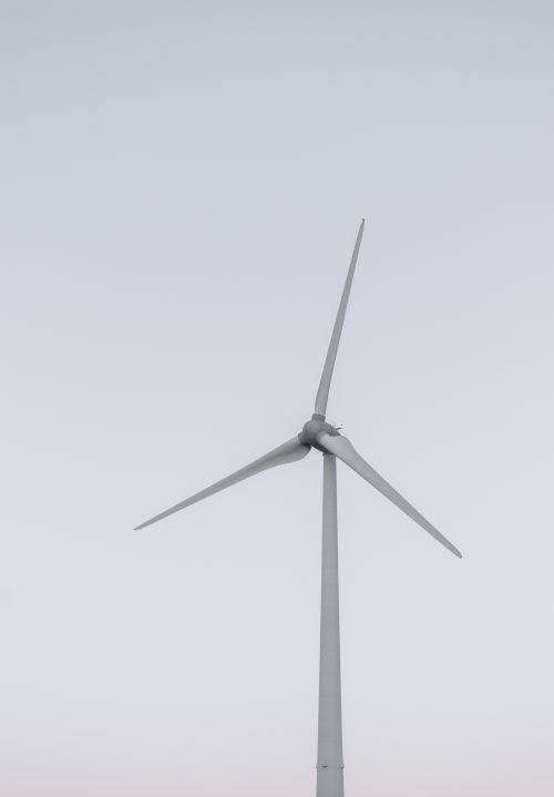Free Minimalist photo of a wind turbine on a clear day, symbolizing renewable energy. Stock Photo