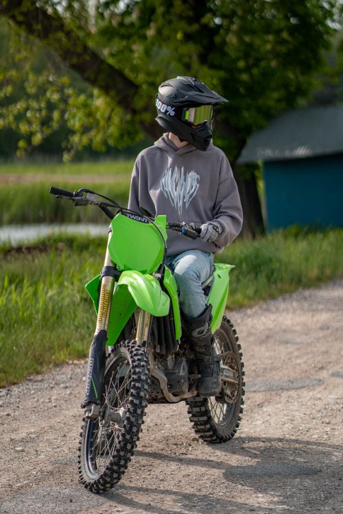 Teen Beat Rider Young Rider on Green Off-Road Motorbike · Free Stock Photo