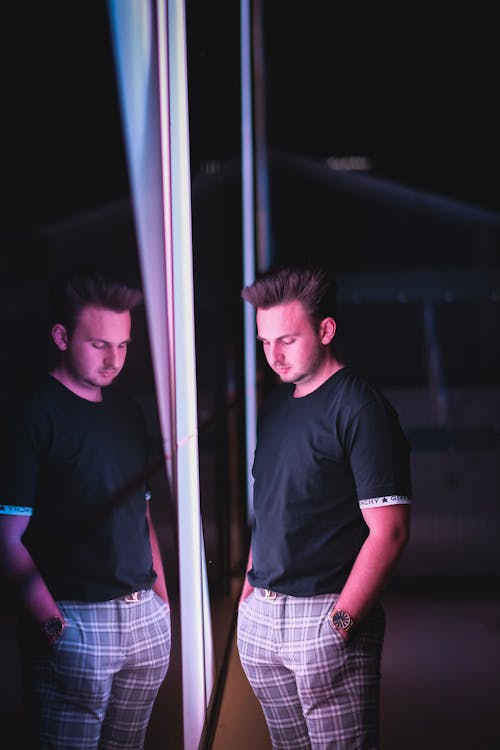 Man Standing in Front of Mirror