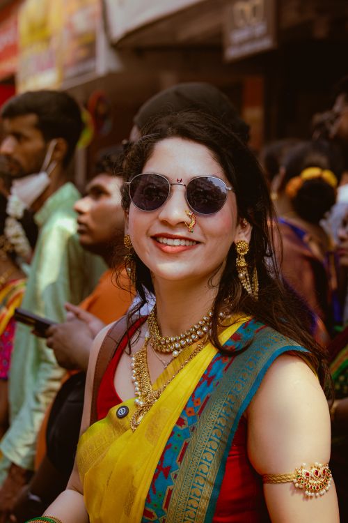 Free Portrait of a woman in traditional Indian attire celebrating a cultural festival outdoors. Stock Photo