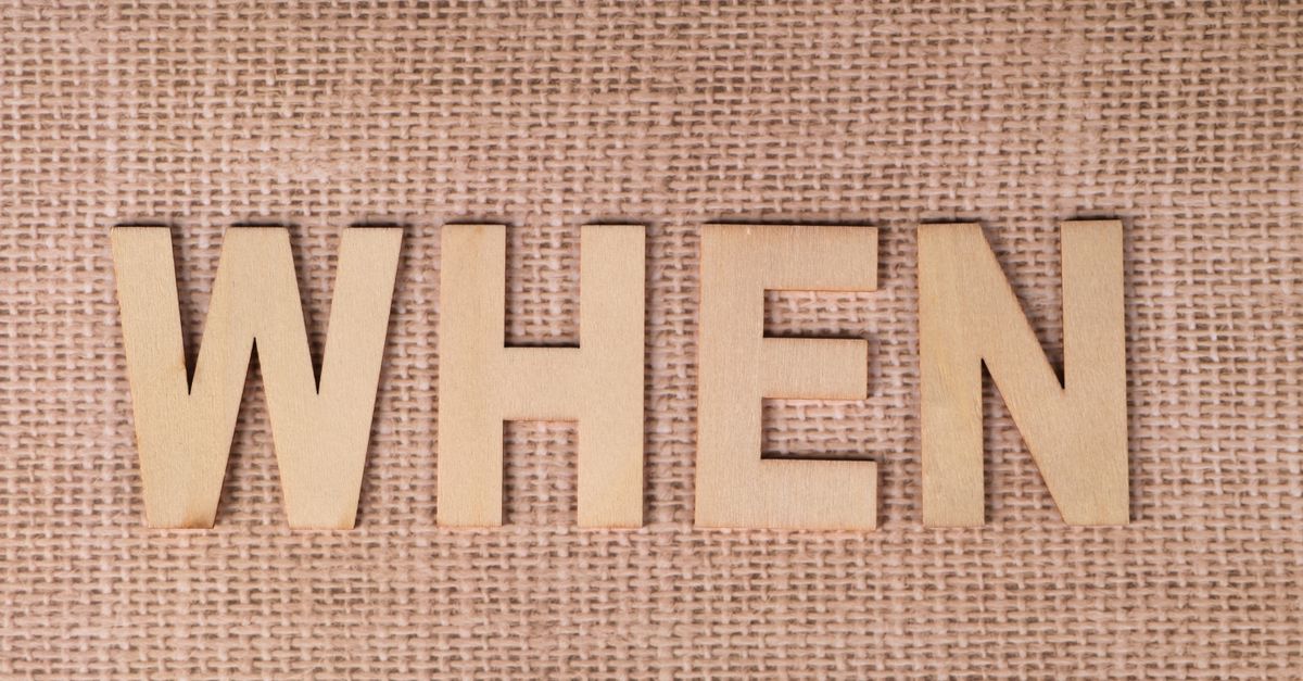 Wooden letters spelling "WHEN" on a textured burlap surface, ideal for concepts of time and planning. - Evidence evidence guide for When is the best time to take Magnesium Glycinate
