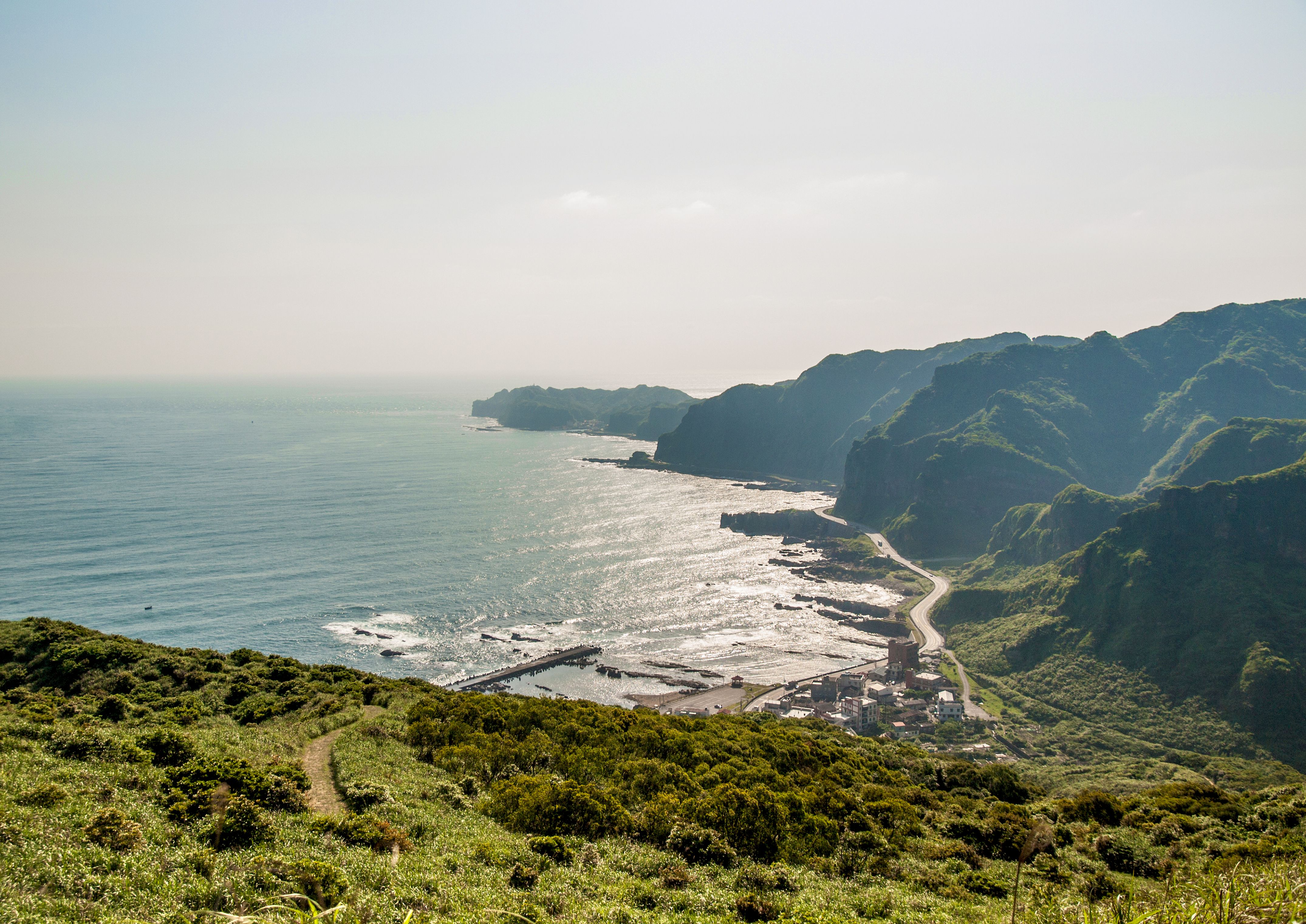 Scenic Coastal Landscape with Hills and Ocean · Free Stock Photo