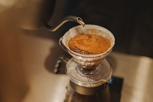 Close-up of pour-over coffee preparation in a Shinjuku café, Tokyo, Japan.