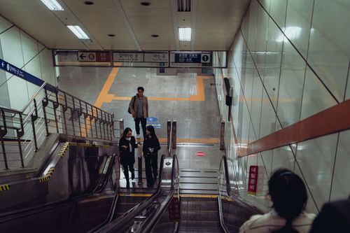 Free People navigating the Suwon subway station, South Korea, showcasing daily urban life. Stock Photo