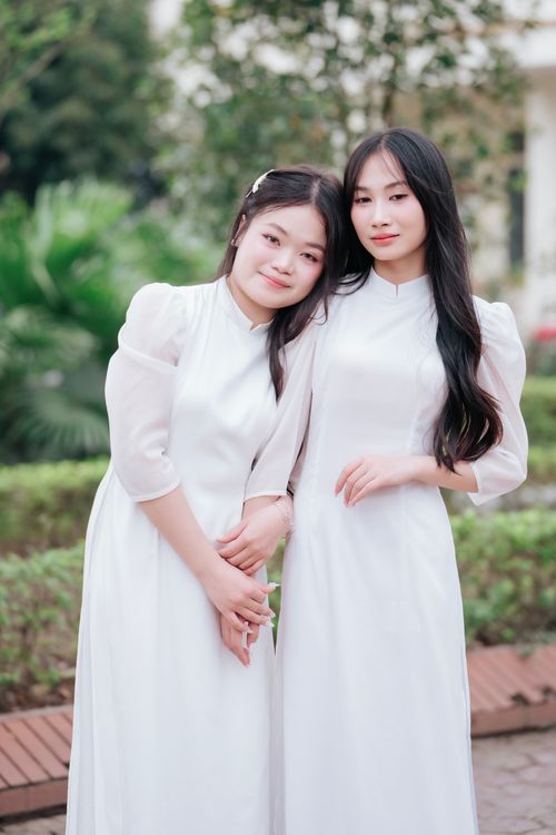 Two Young Women in Elegant White Dresses Outdoors Free Stock Photo Two Young Women in Elegant White Dresses Outdoors Free Stock Photo