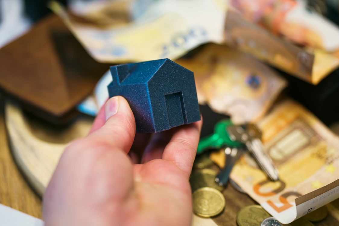 Model house, money and keys