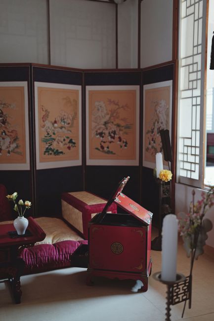 Elegant traditional Korean hanok guest room interior with wooden furniture and paper screens