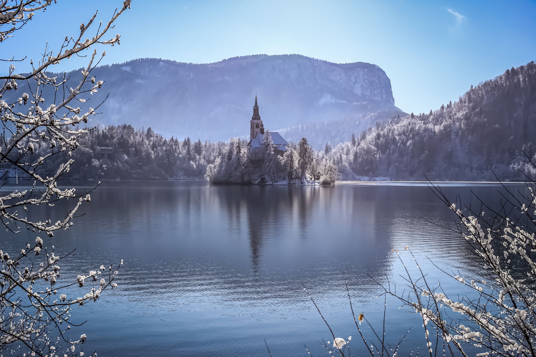 Lake Bled in winter with snow around the island church