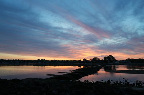 Free Captivating sunrise view at Cove Island Park with vibrant skies reflecting on the water. Stock Photo