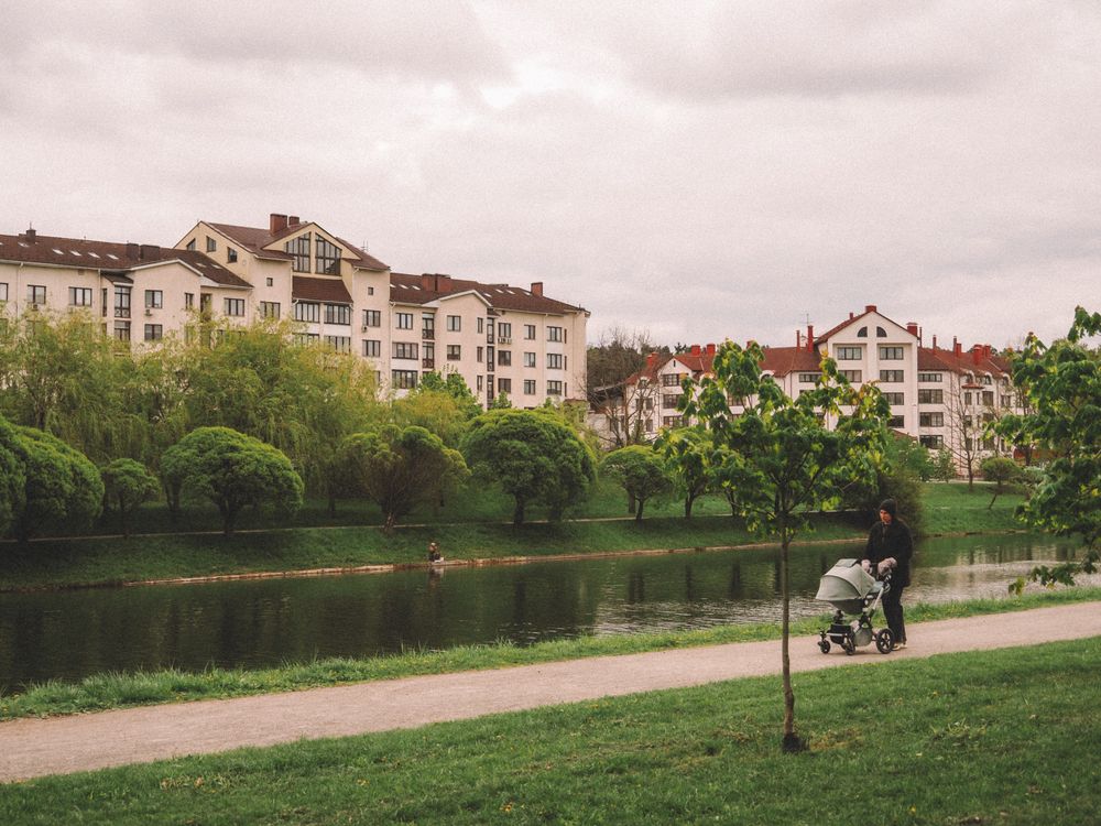 Stroller Walk Stroller Walk by Riverside in Urban Park · Free Stock Photo