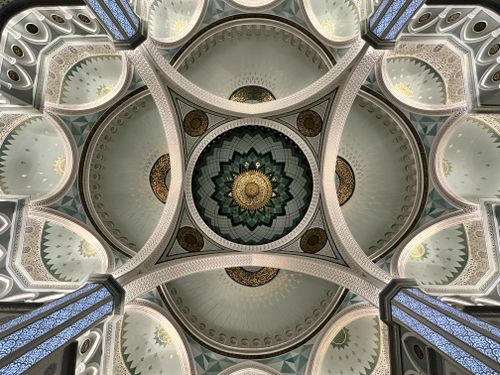 Free Stunning architectural detail of a mosque dome ceiling with intricate patterns and designs. Stock Photo
