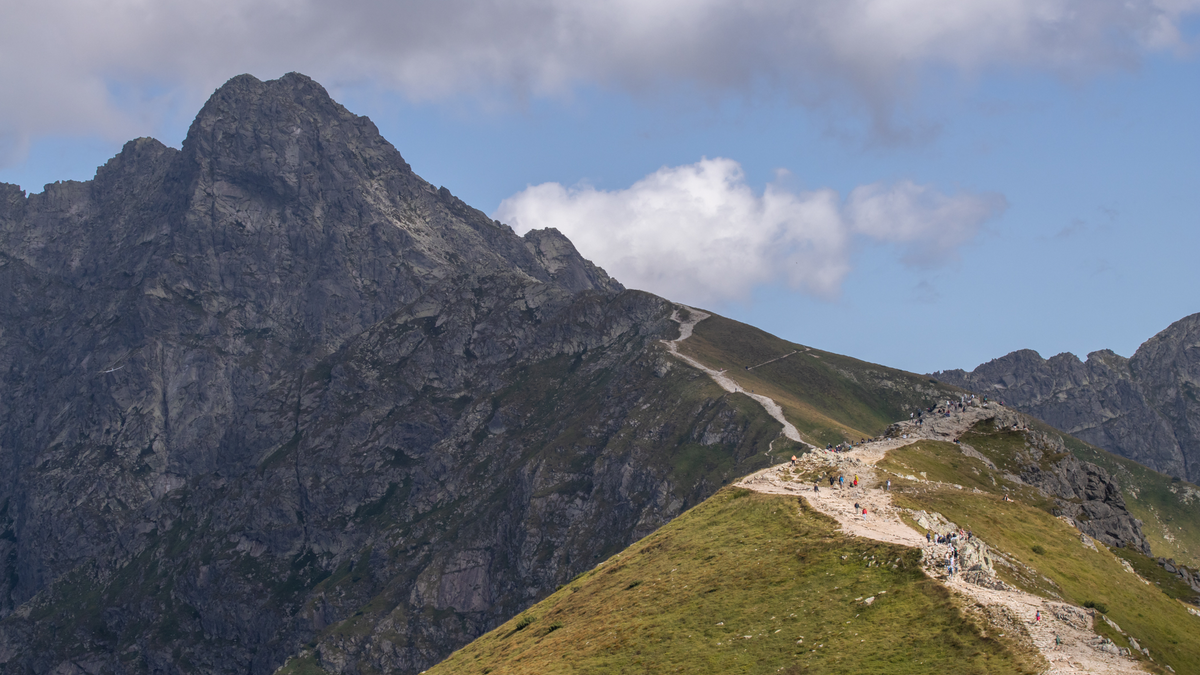 Scenic view of hikers on a trail in the Tatra Mountains, Zakopane.