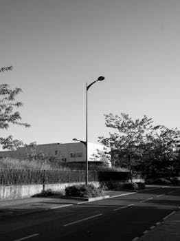 Monochrome image of a quiet street in Compiègne, France during day.