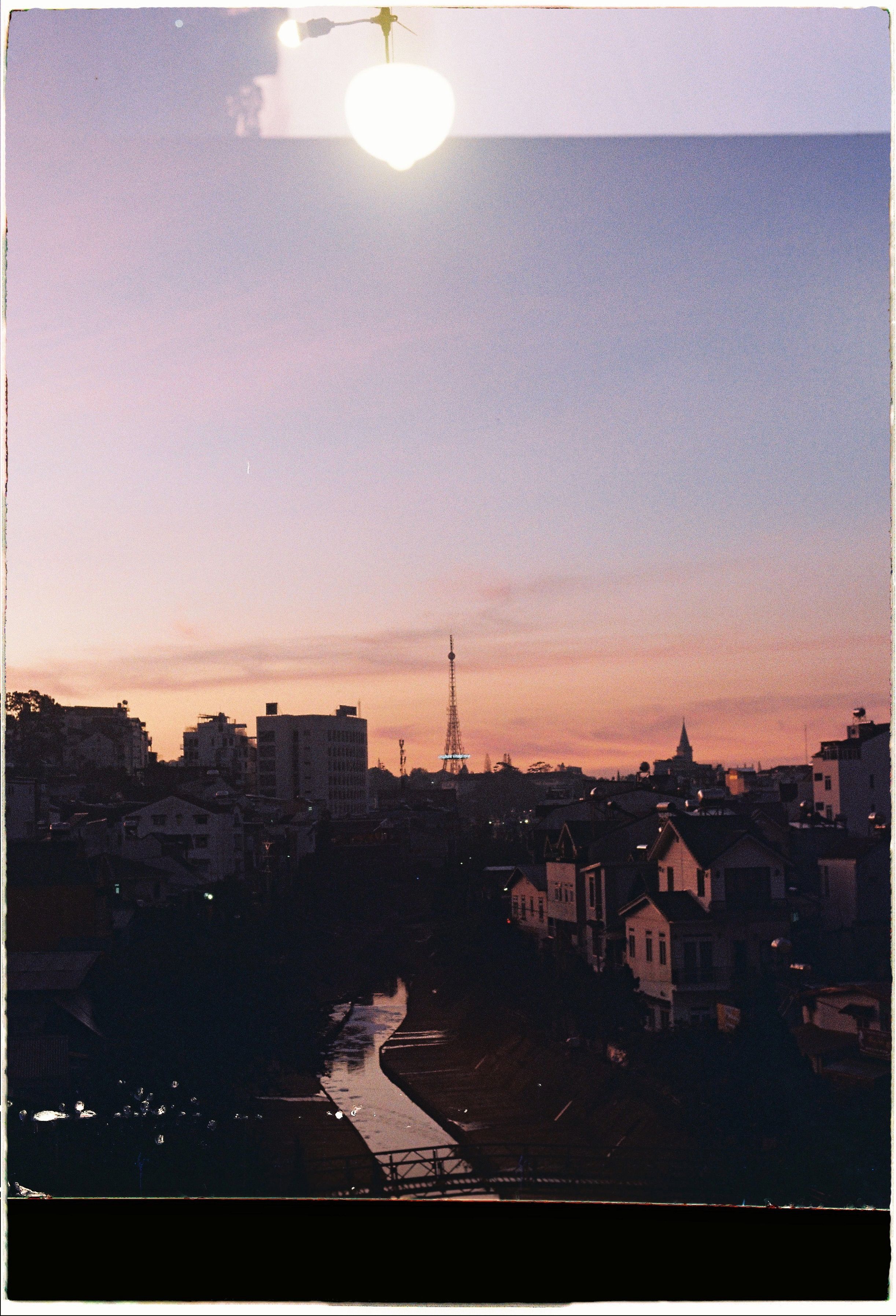 Sunset over Urban Skyline with Tower View · Free Stock Photo