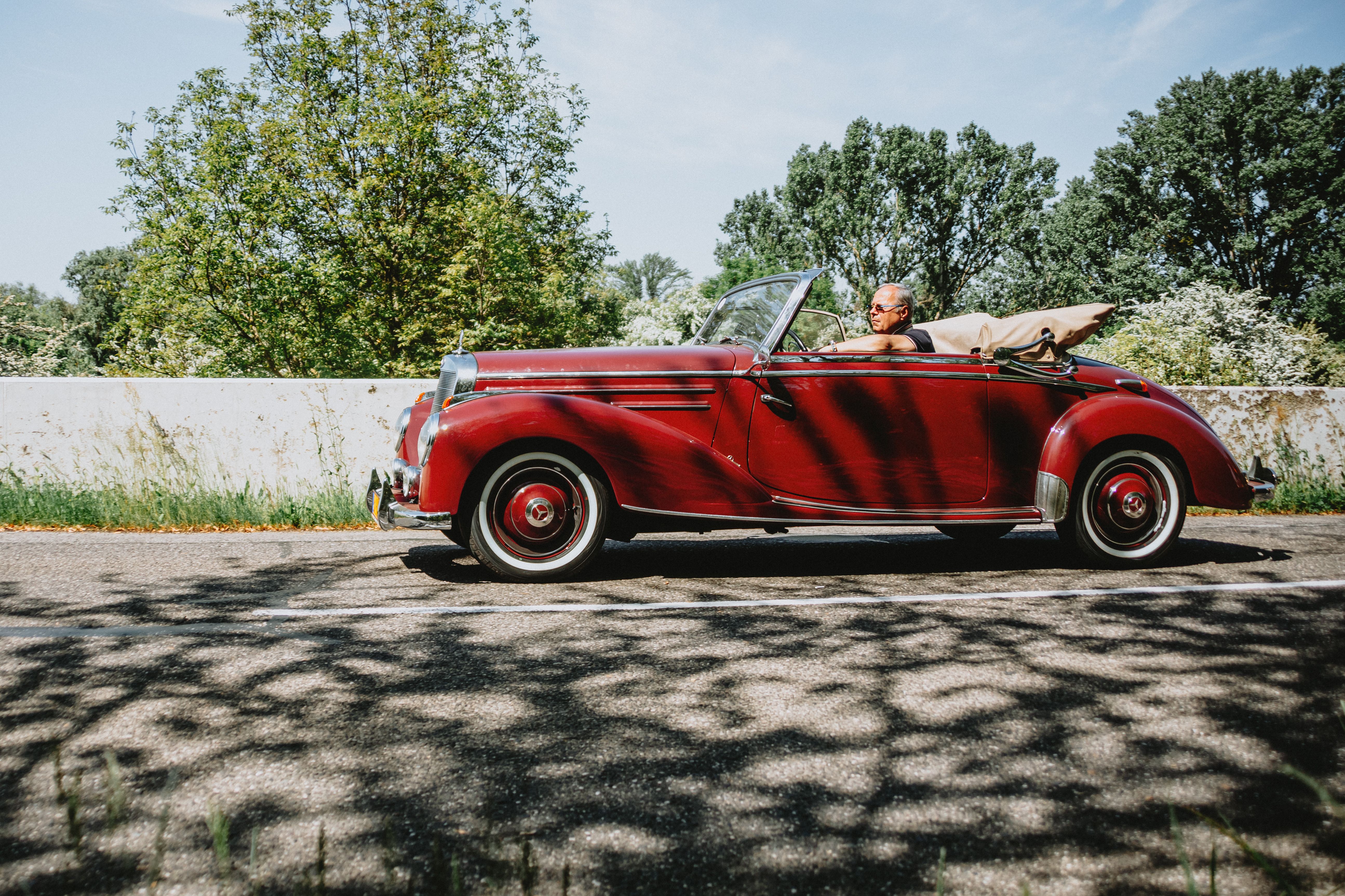 Vintage Convertible Ride Amidst Scenic Greenery · Free Stock Photo