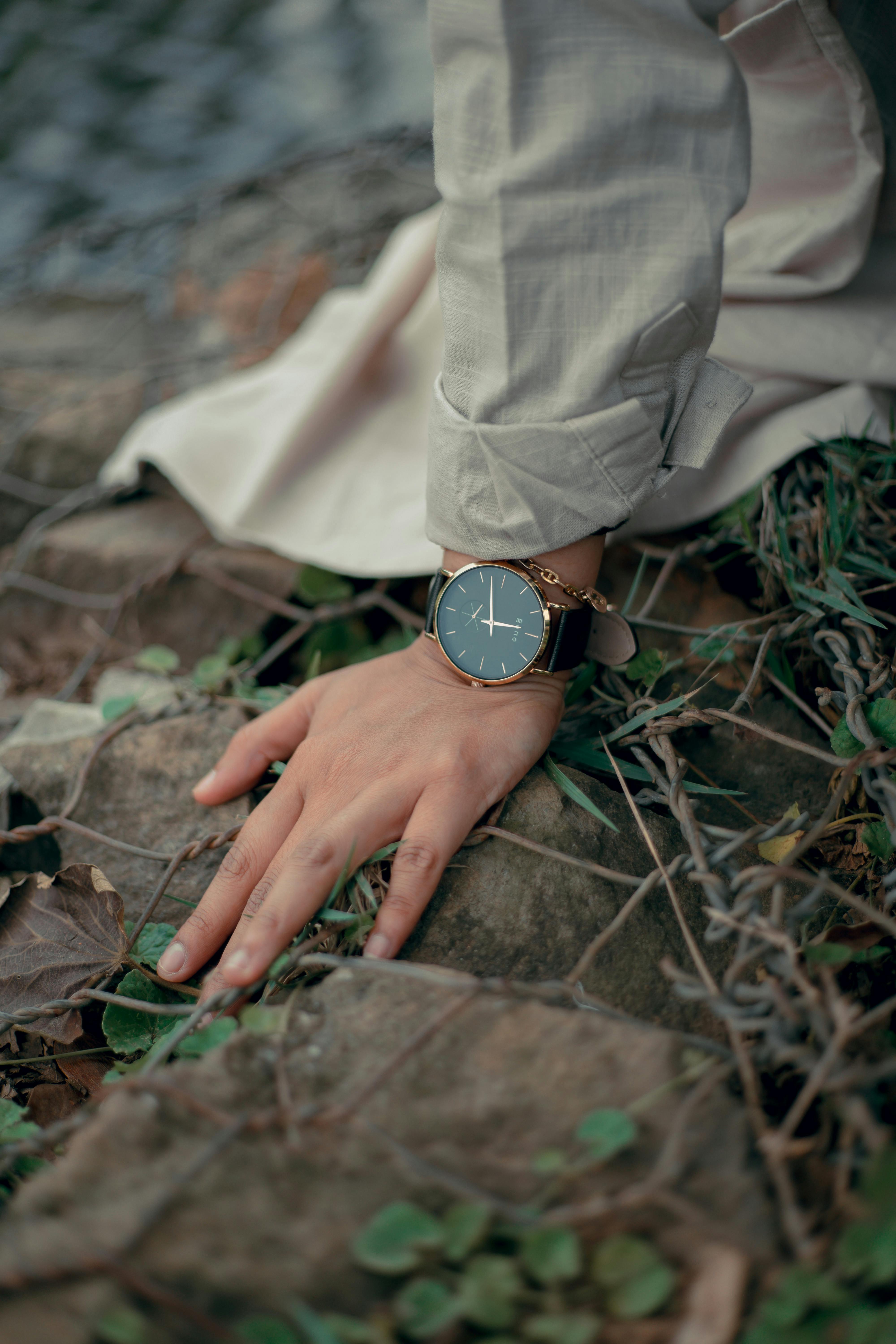 Free Person Wearing Round Gold-colored Analog Watch Japanese Techniques
