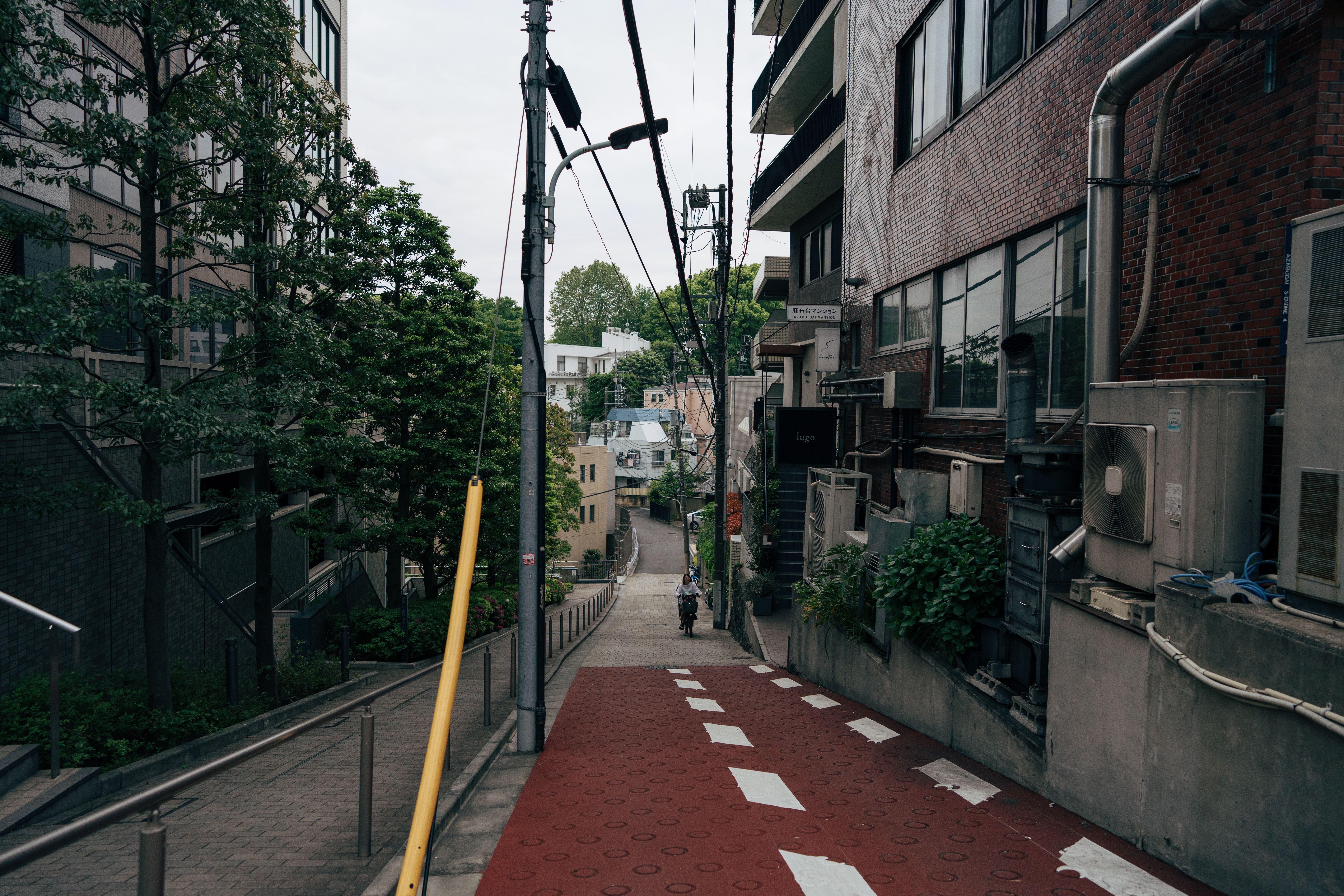 Discover a serene street scene in Tokyo, capturing a peaceful side of the bustling city.