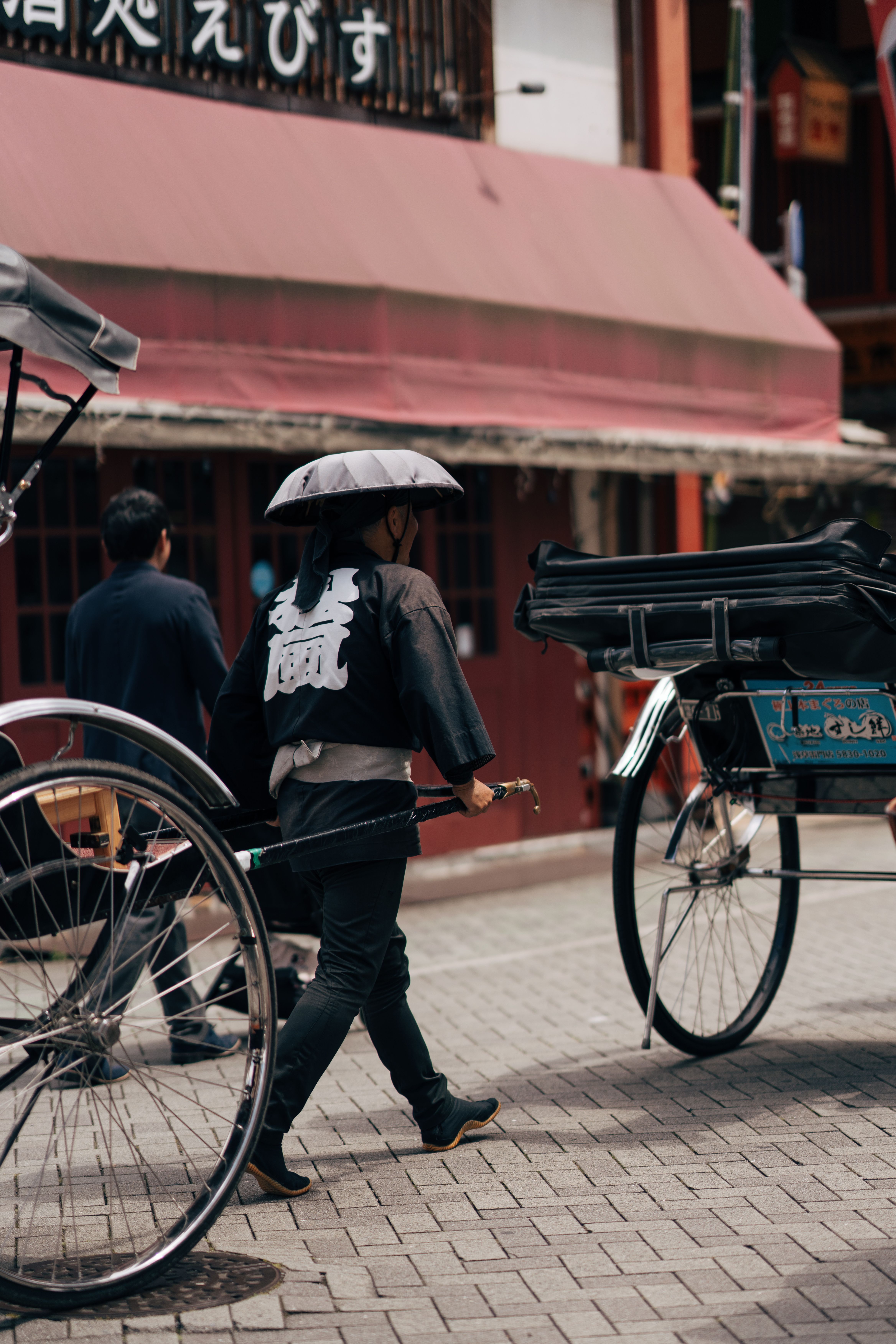 Traditional Rickshaw Driver in Tokyo Street · Free Stock Photo