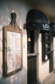 Inviting tea salon exterior with vintage charm and shaded ambiance.