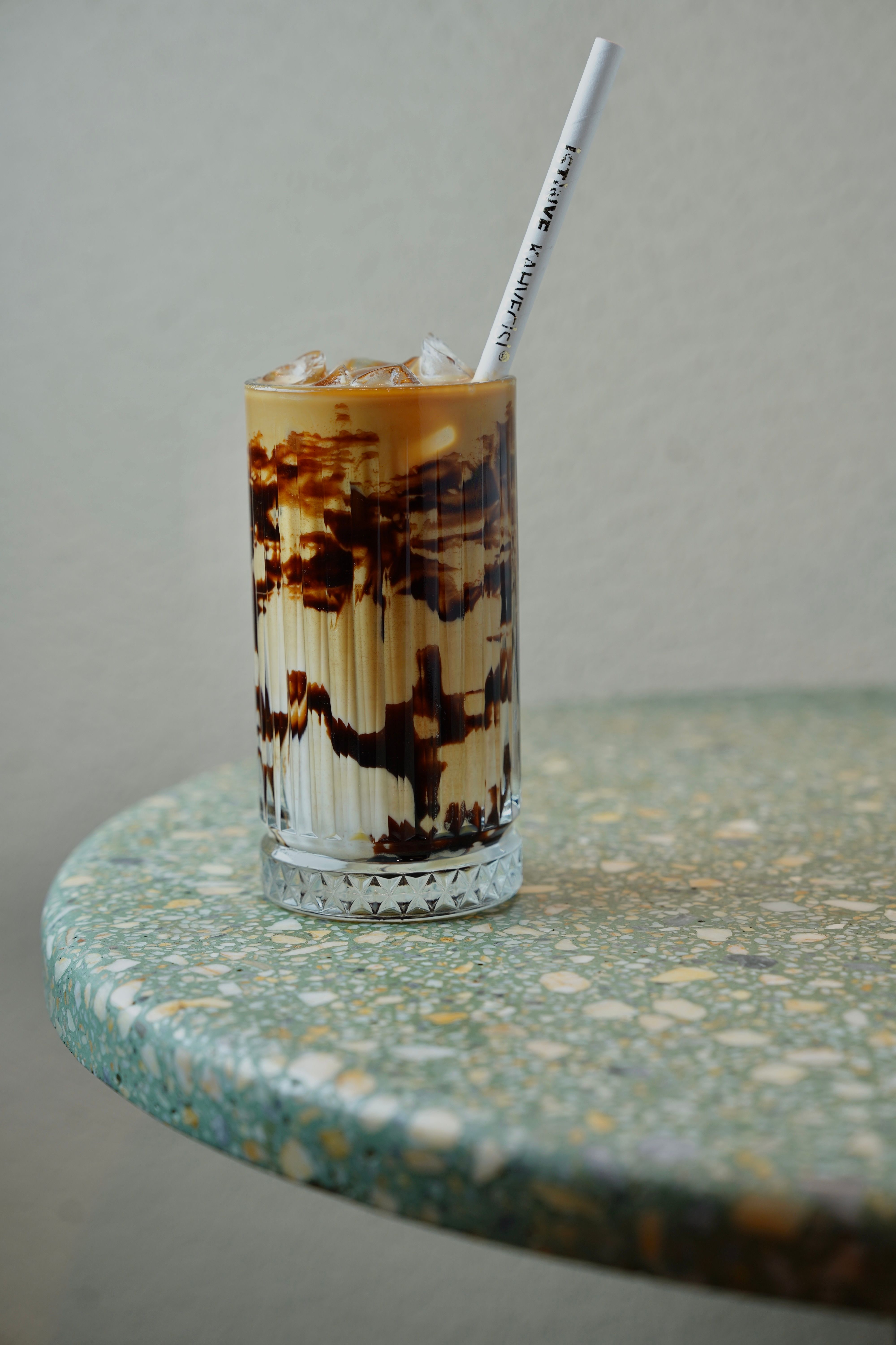 Iced Coffee with Chocolate Drizzle on Marble Table · Free Stock Photo