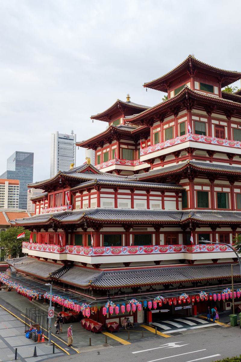 The tiered red facade of Buddha Tooth Relic Temple in Chinatown, Singapore