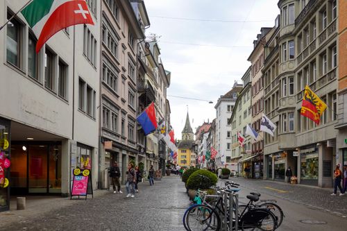 Free Explore the vibrant street life and historic architecture in the heart of Zurich's old town. Stock Photo