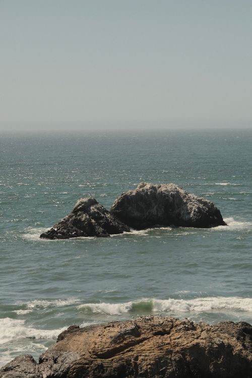 Free Serene ocean view with rocky formations off San Francisco's coast in clear daylight. Stock Photo