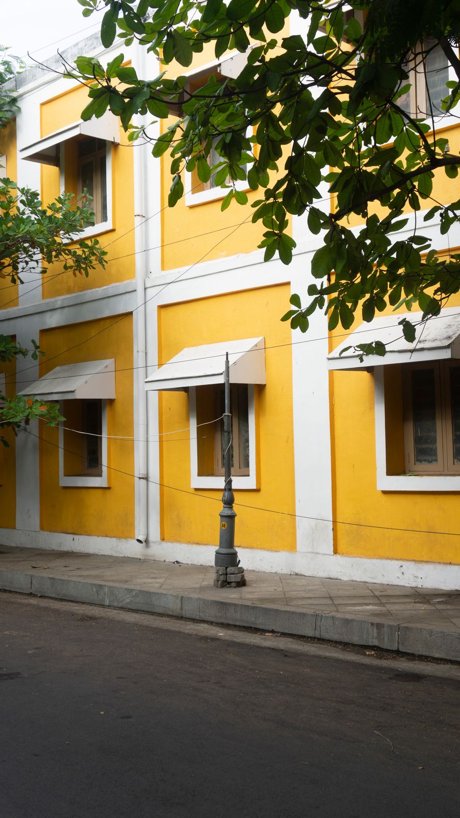 Colonial yellow building in the French Quarter of Puducherry