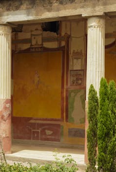 Explore the preserved frescoes and Roman architecture of Pompeii, Italy.