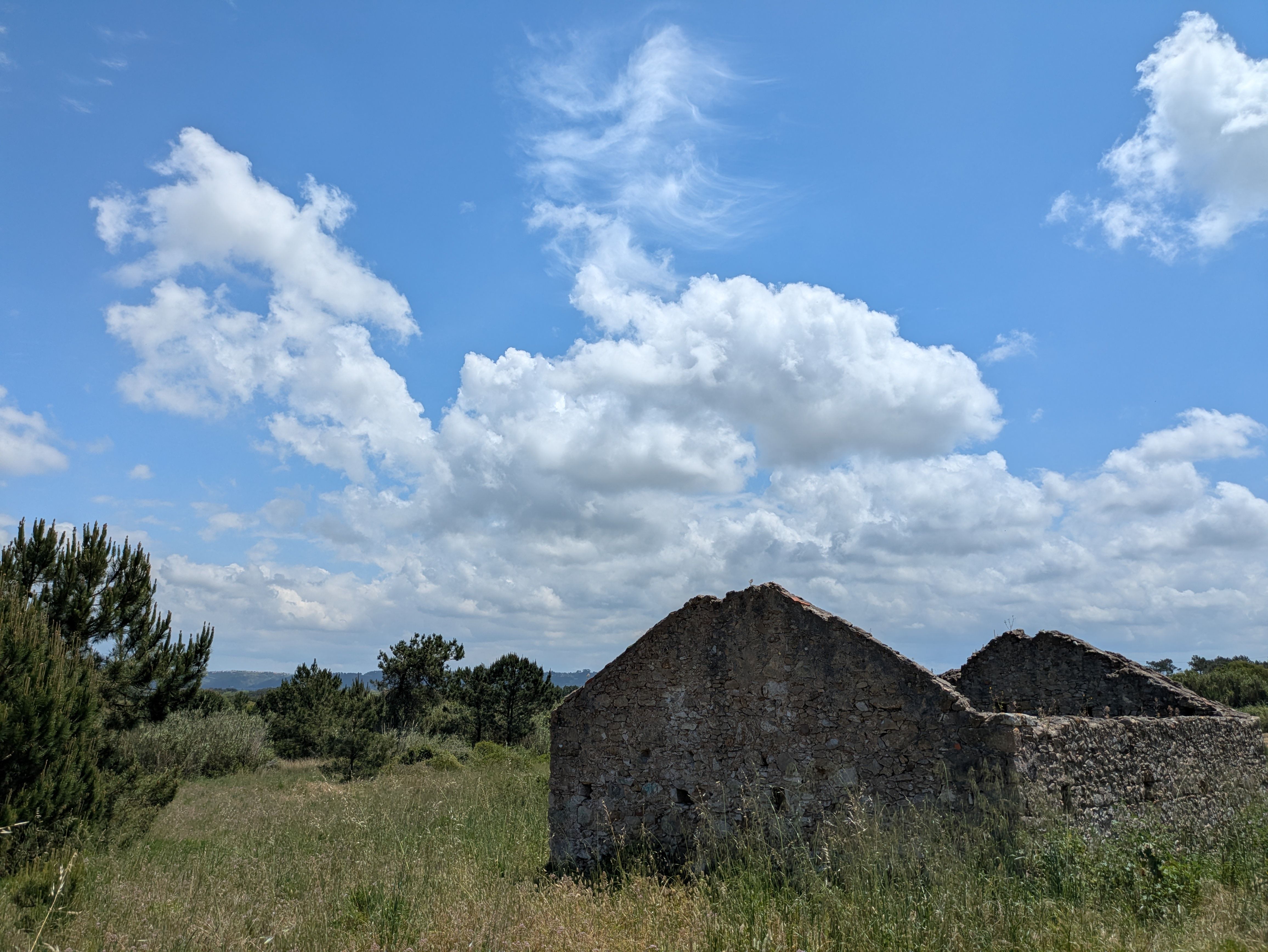 Stone Cottage Ruins Under a Clear Blue Sky · Free Stock Photo