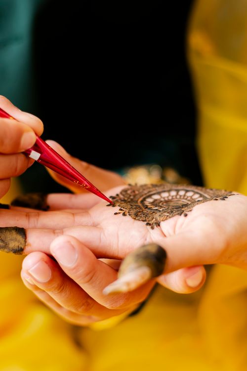 Free Intricate mehndi design being applied on a hand with precision in Kathmandu, Nepal. Stock Photo