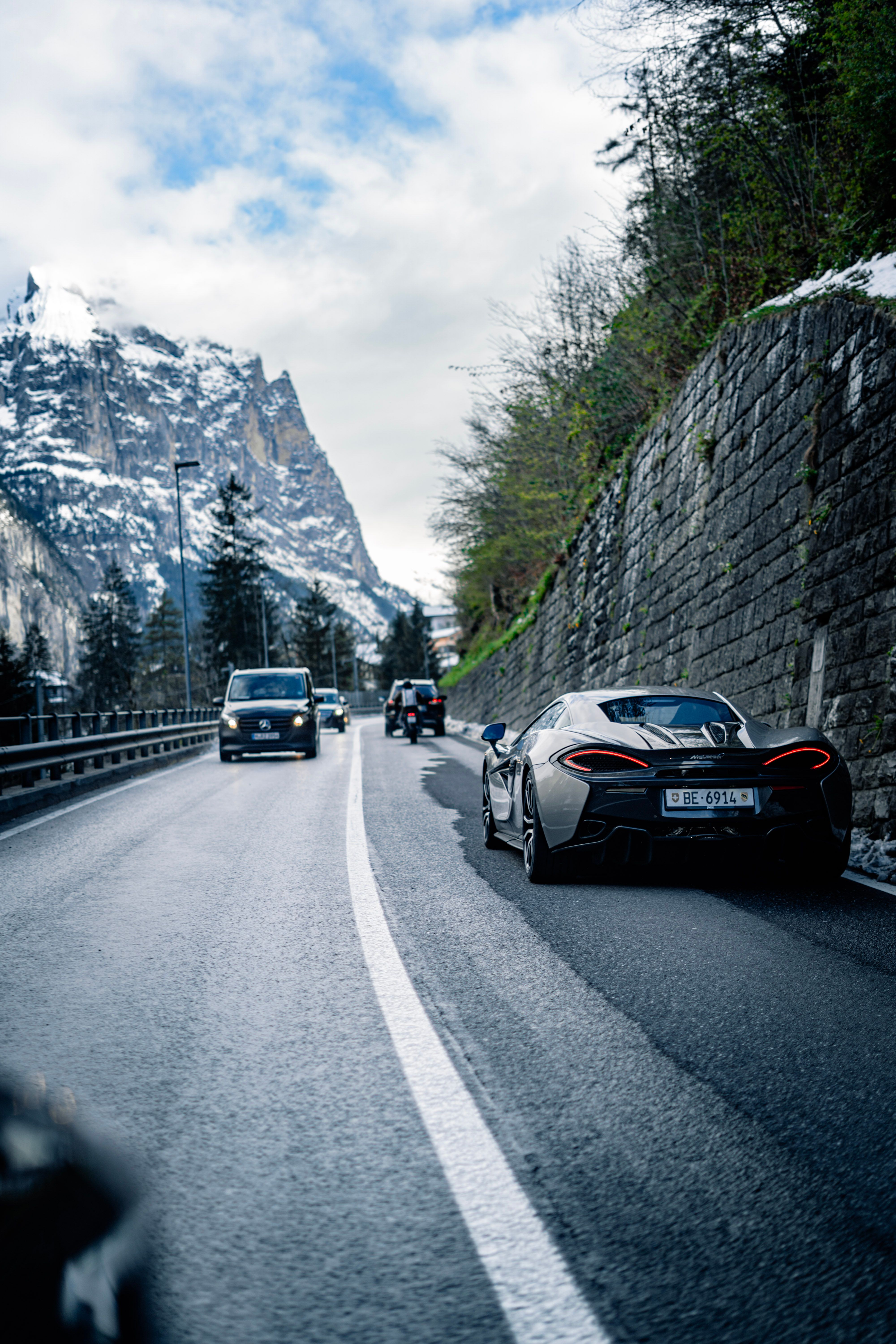 Luxury Sports Car on Scenic Mountain Road · Free Stock Photo