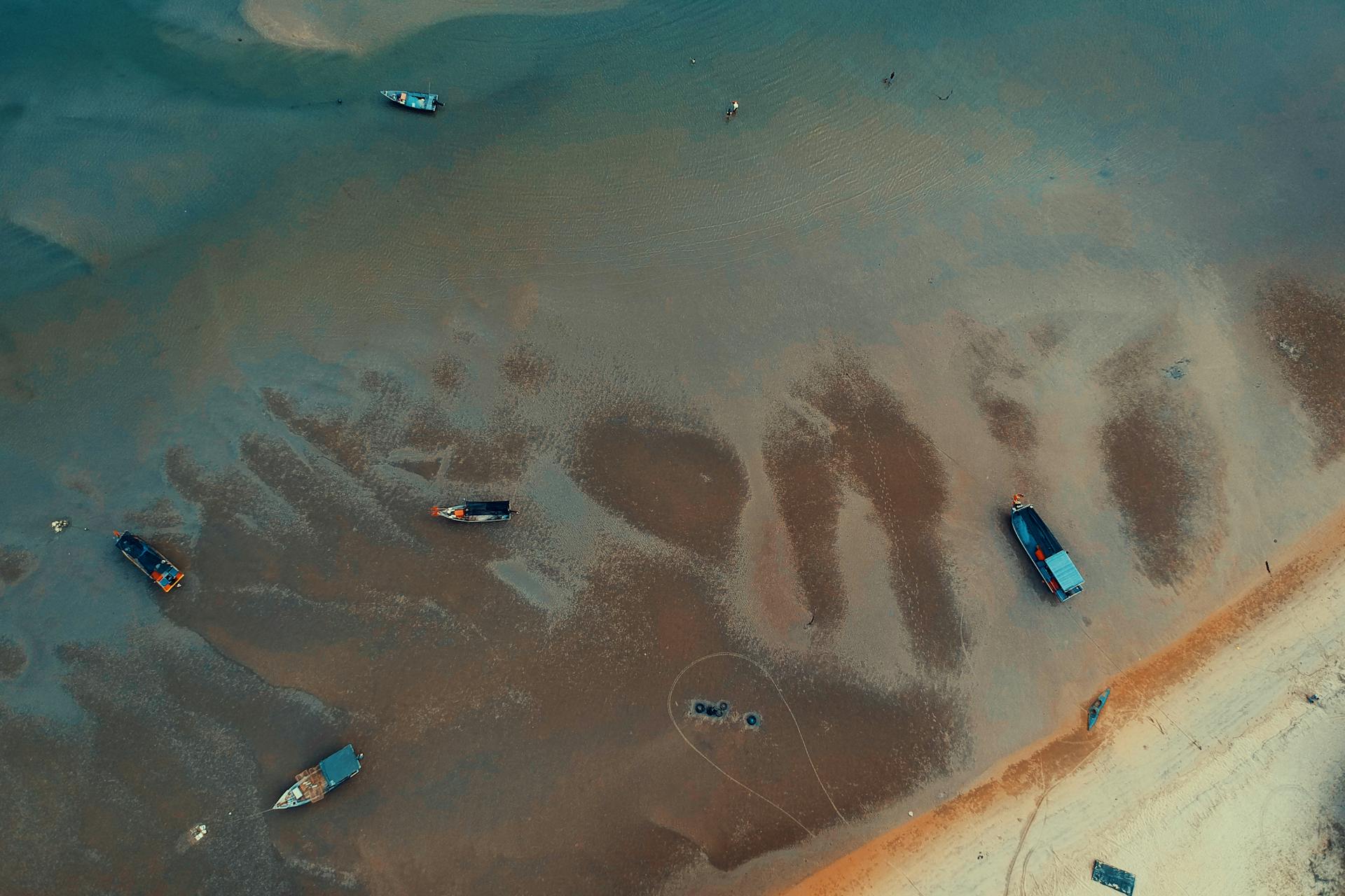 Aerial Shot Of Water Crafts Close To The Seashore