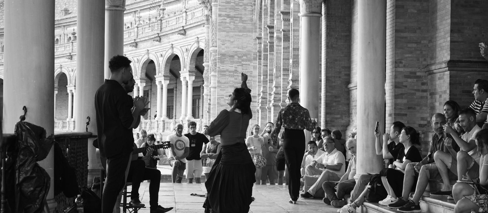 Traditional flamenco dancers performing in Plaza de España, Seville, Spain.