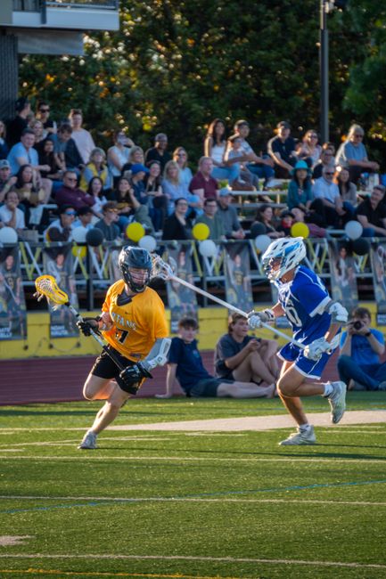 Kyle Harrison demonstrating a perfect lacrosse split dodge technique during a transition play.