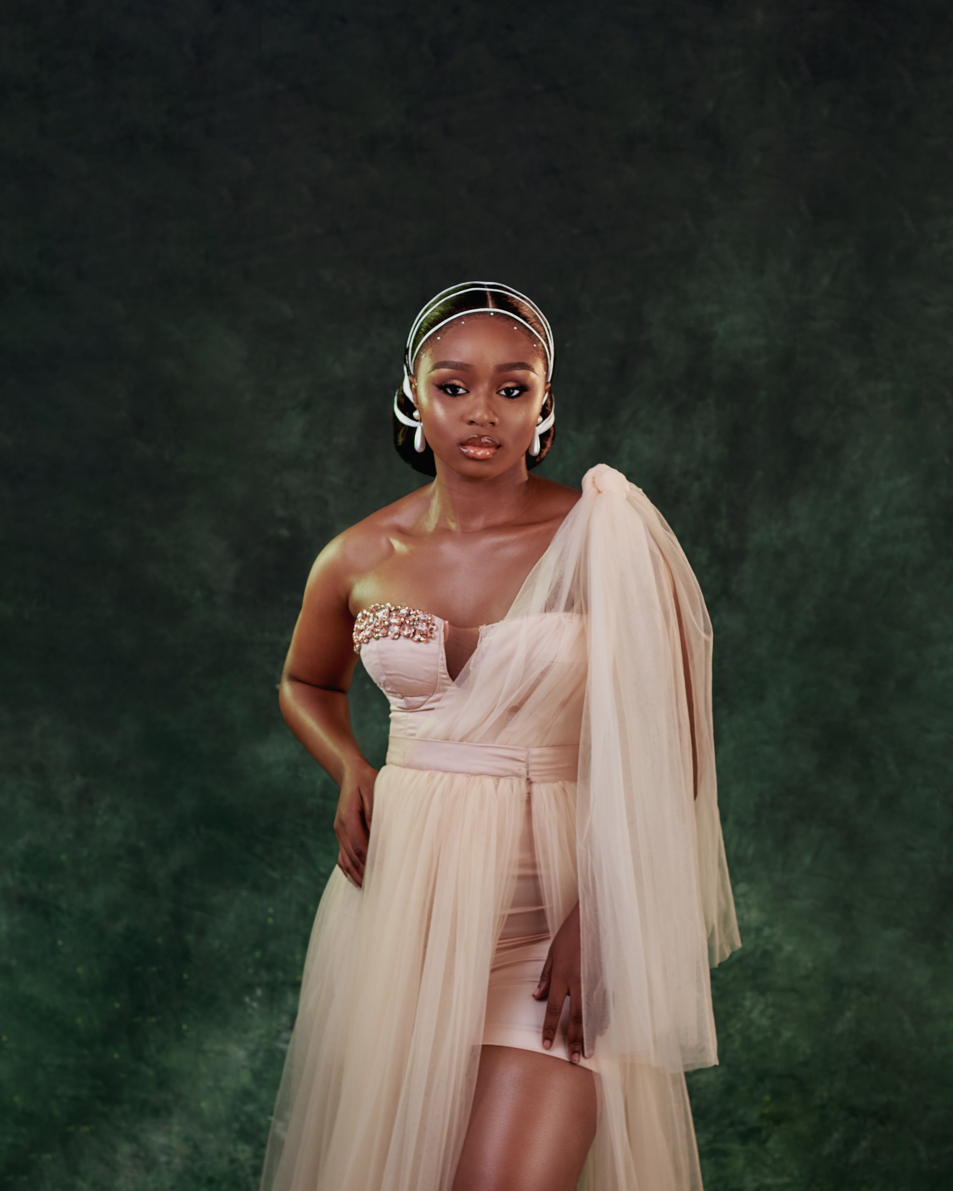 Elegant Woman in Evening Gown with Bold Jewelry