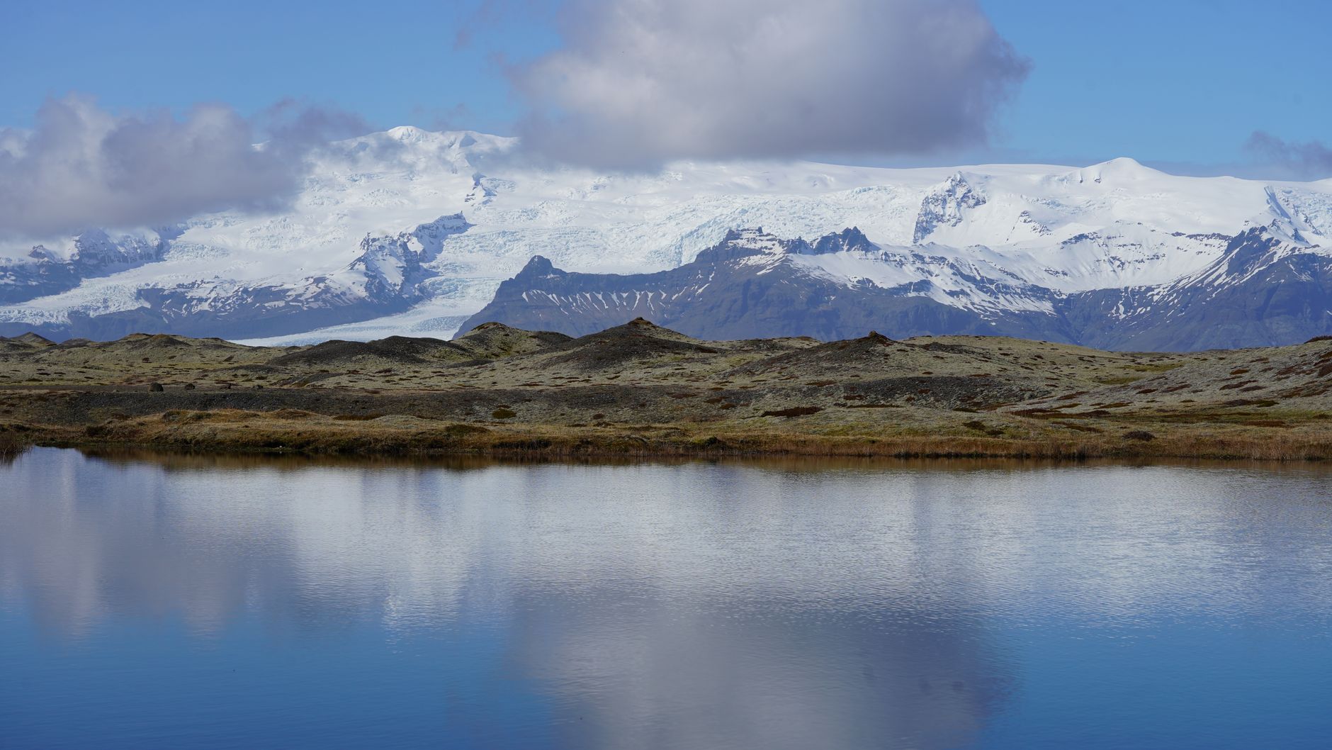Vatnajokull glacier tongue meeting black volcanic plain