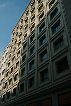 Modern building facade with geometric window design in São Paulo, Brazil.
